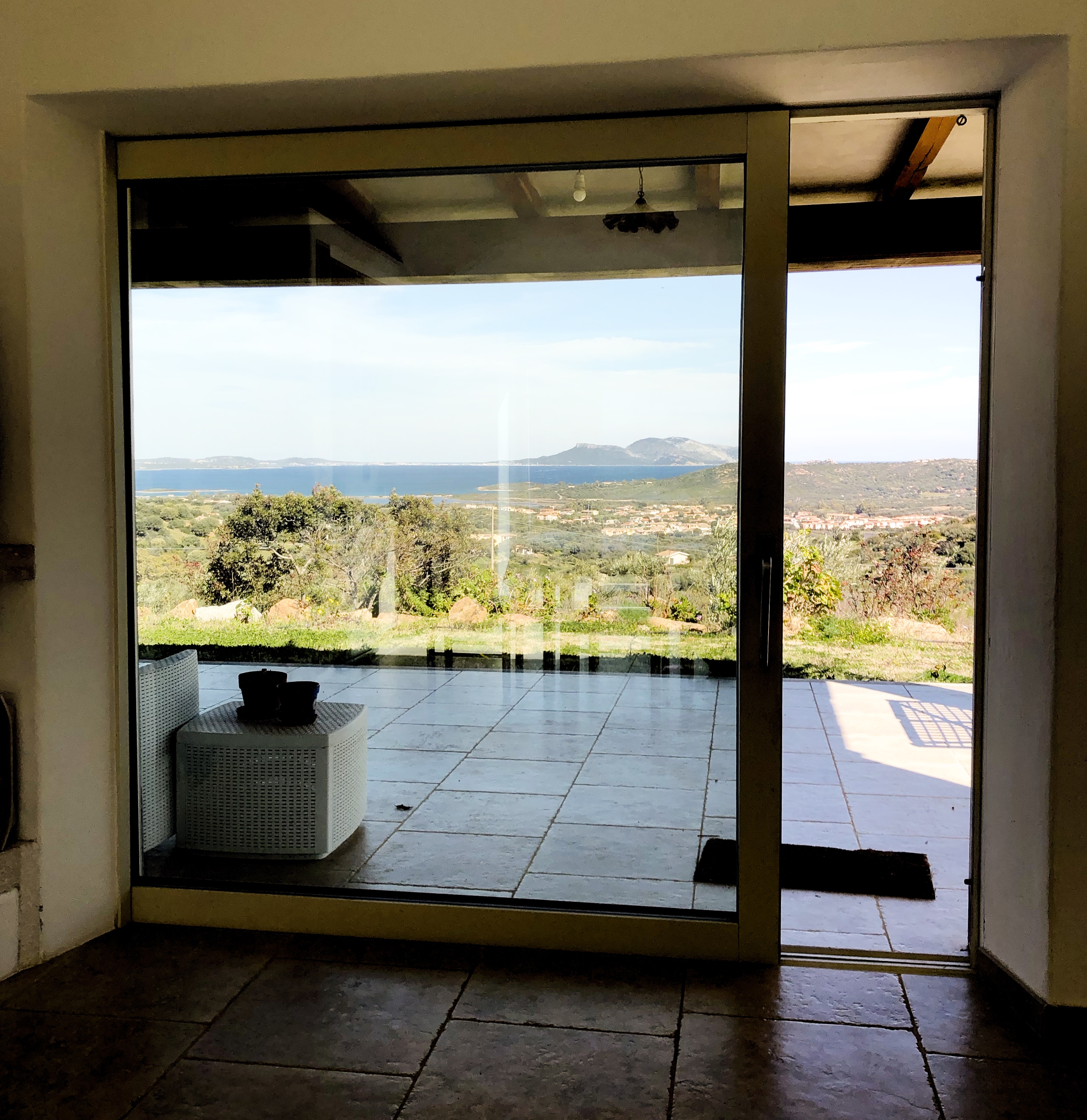 Belvedere window framing the coast and Tavolara