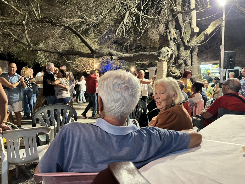 People dancing at a village night gathering
