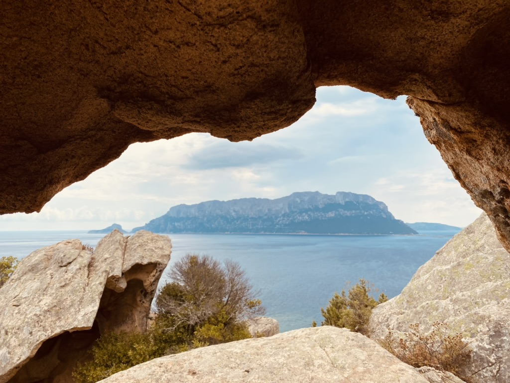 Tavolara framed by granite rocks at La Vedetta