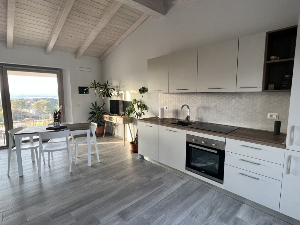 Luce kitchen and dining space with the view beyond