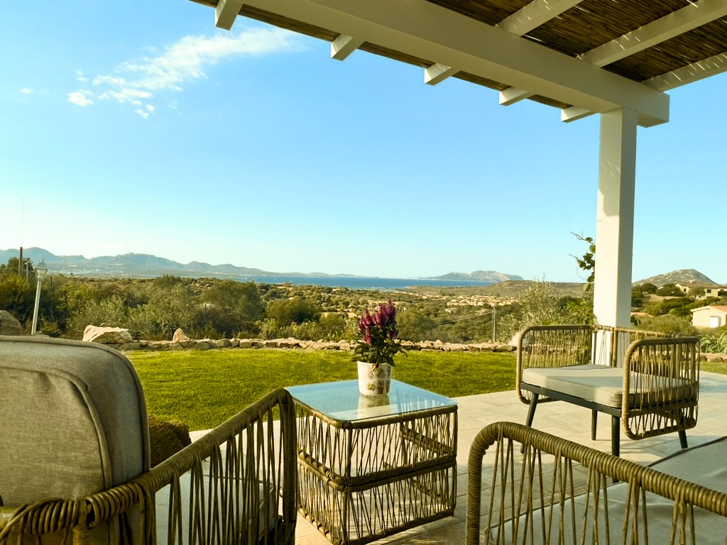 Luce covered terrace with sea and hillside view